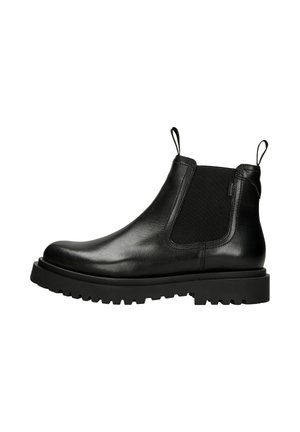 Black leather Chelsea boot with elastic side panels, pull tabs, and a chunky rubber sole. Smooth texture with a sleek design.