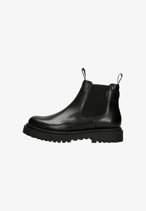 Stivale Chelsea in pelle nera con pannelli elastici laterali, linguette per il trasporto e una suola in gomma spessa. Texture liscia con un design elegante.
