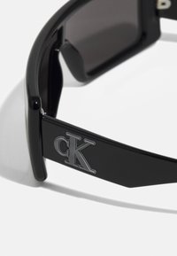 Calvin Klein Jeans UNISEX - Ochelari de soare - black