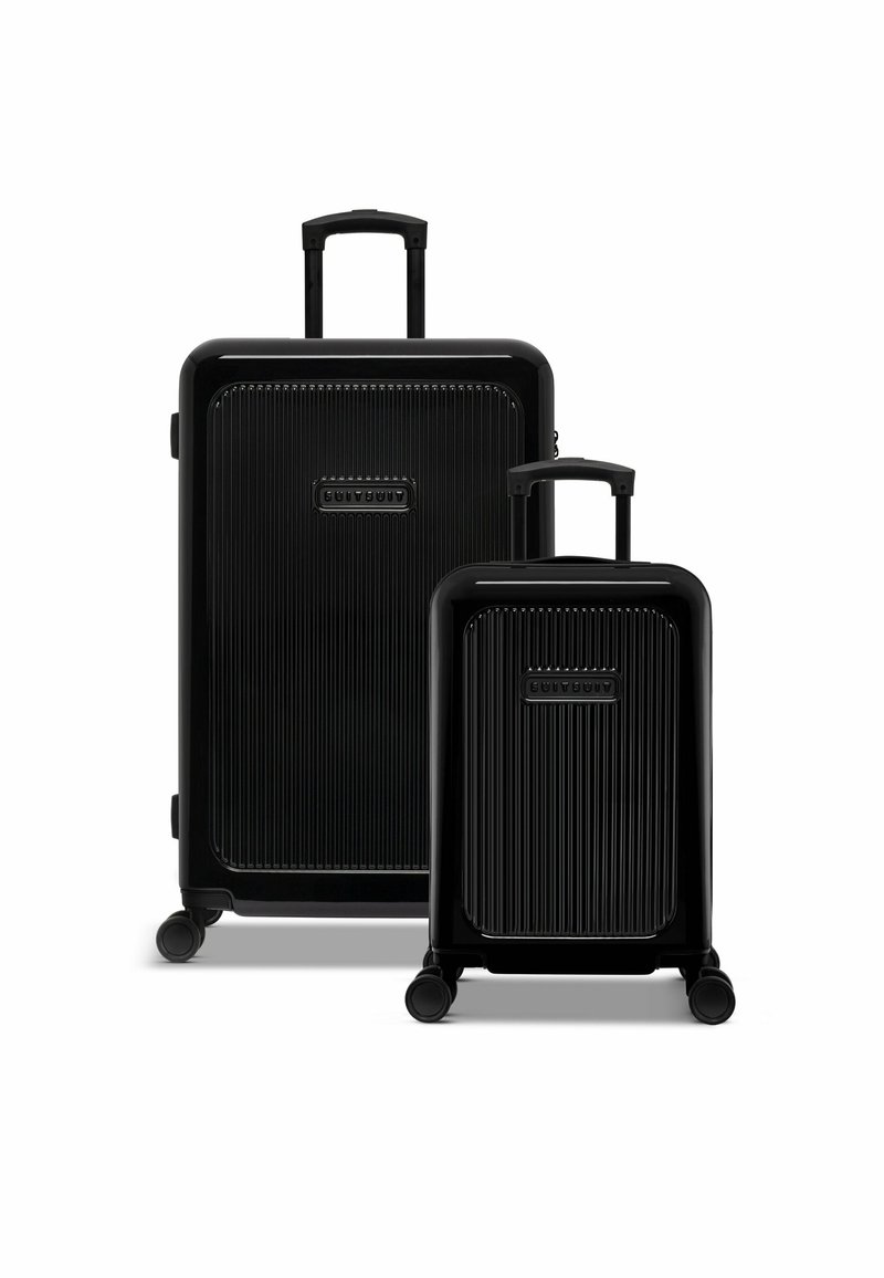 Two black hard-shell suitcases with vertical stripes. The larger suitcase has a retractable handle, while the smaller one is compact with wheels.