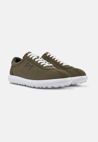 Olive green sneakers with white laces, smooth fabric, rounded toe, and textured white rubber sole. Features a subtle logo detail on the side.
