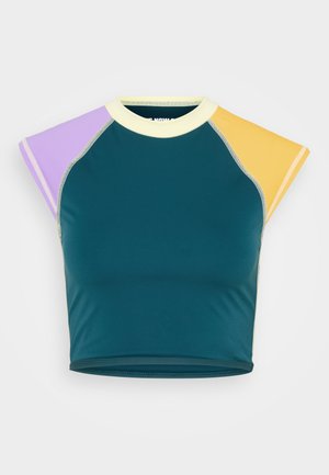 Short-sleeve cropped top with dark teal body, purple left sleeve, yellow right sleeve, and cream collar against white background.