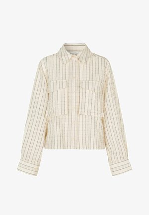 Kreemi värvi lühike särk, millel on vertikaalsed sinised triibud. Omab kraega kaelust, kahte eesmist taskut ja nööbihendust. Tekstuuriga kangas.