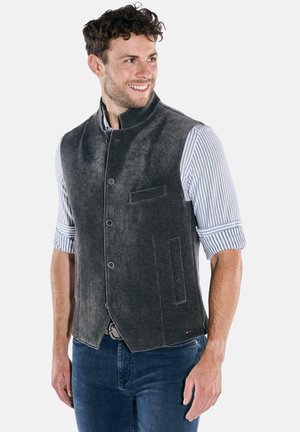 Charcoal gray corduroy vest with a high collar, front buttons, and two pockets. Worn over a blue and white striped shirt.