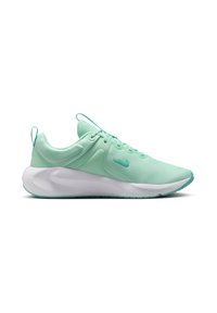 Baskets de sport vert menthe avec une semelle blanche épaisse et un petit logo swoosh sur le côté, vues de l'extérieur.