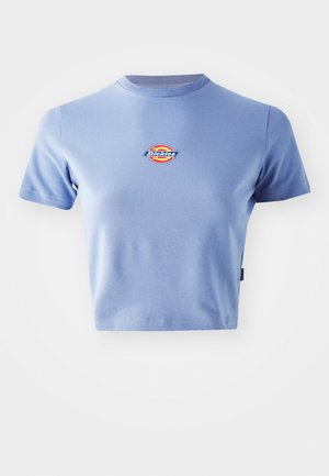 Short-sleeve crop top in light blue cotton fabric. Features a circular multicolored logo with "Dickies" text on the chest.