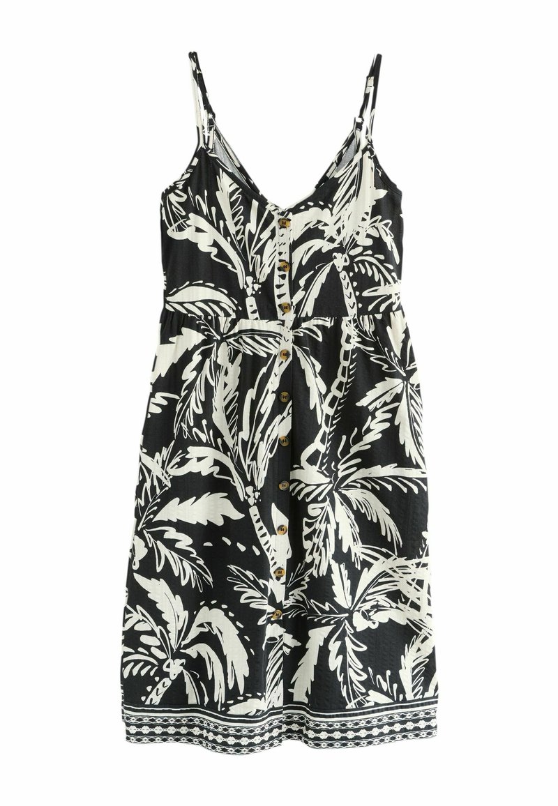 Schwarz-weißes ärmelloses Kleid mit einem Palmenblattmuster, das einen Knopfverschluss vorne, eine taillierte Taille und eine dekorative Bordüre entlang des Saums aufweist.