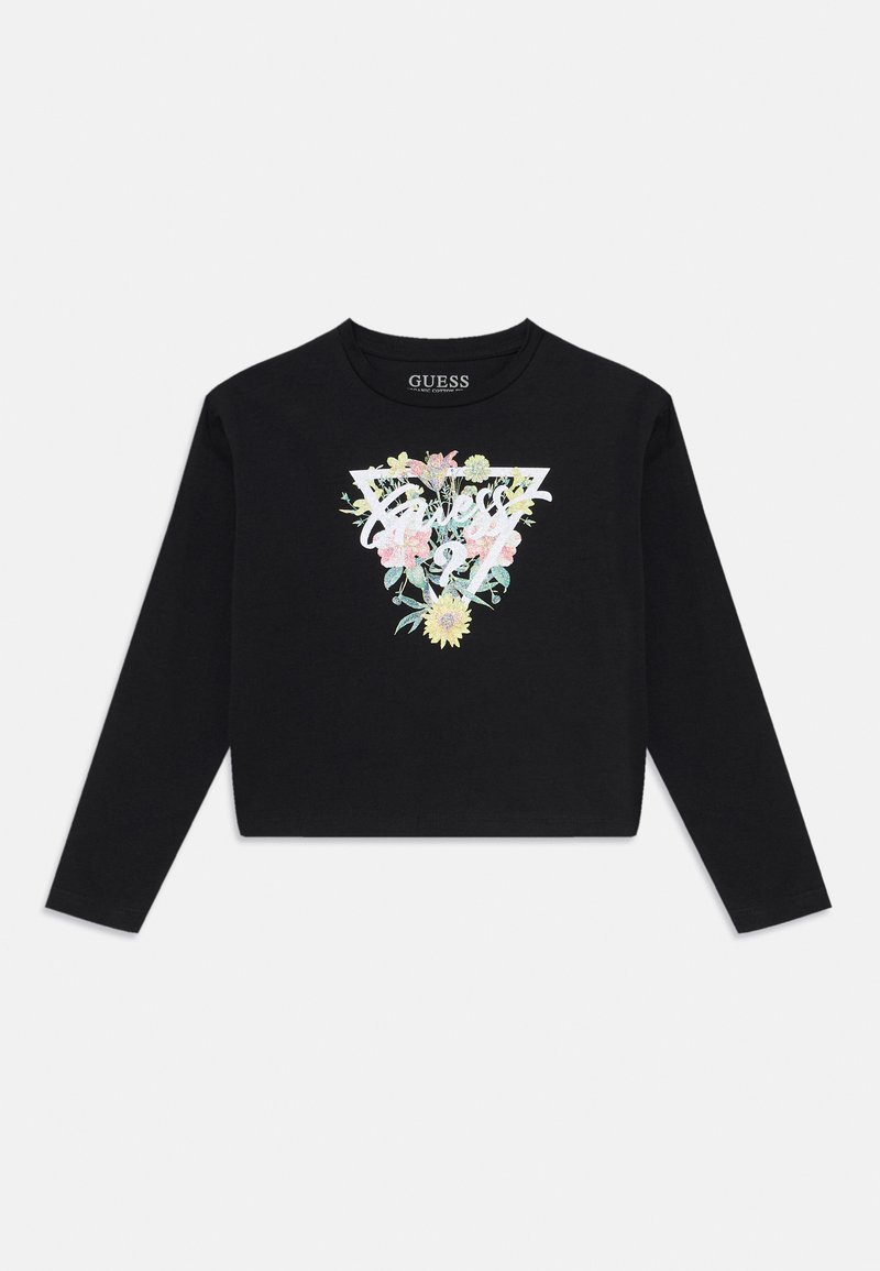 Svart langermet crop top med et fargerikt blomsterdesign i trekantform, hvor merkevaren "Guess" er tydelig vist.