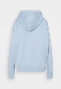 Sweat à capuche bleu clair vu de dos avec manches longues et poignets et ourlet côtelés.