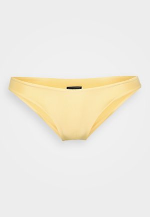 Gul bikini bund lavet af glat, elastisk materiale. Har et lavtaljet design med minimal dækning og slanke sømme.