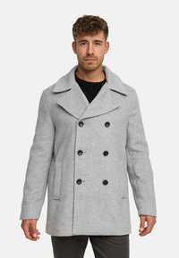 Grijze wolmix peacoat met een dubbelzijdige voorkant, grote revers en zwarte knopen; beschikt over zijzakken en een gestructureerde pasvorm.
