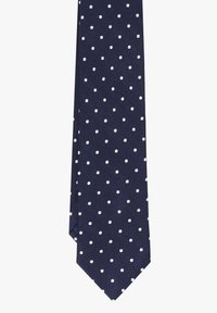 Corbata de color navy con lunares blancos, hecha de una tela texturizada. Presenta una punta afilada y un patrón de rayas diagonales tejido en el material.