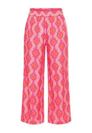 Růžové kalhoty se širokými nohavicemi s elastickým pasem, zdobené vlnitým abstraktním vzorem v odstínech růžové, oranžové a žluté.
