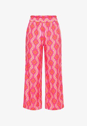 Růžové kalhoty se širokými nohavicemi s elastickým pasem, zdobené vlnitým abstraktním vzorem v odstínech růžové, oranžové a žluté.