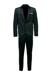 Completo verde in velluto con colletto sciallato in satin nero, design slim fit, due tasche frontali e chiusura con un solo bottone. Presenta un fazzoletto bianco nella tasca.