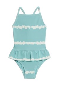 Lichtblauwe zwemkleding met een peplumdetail, vervaardigd uit een gestructureerde stof met witte tie-dye strepen. Verstelbare bandjes verbeteren de pasvorm.