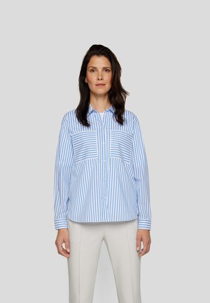 Light blue and white striped button-up shirt with two front pockets; smooth fabric, relaxed fit, and long sleeves with buttoned cuffs.