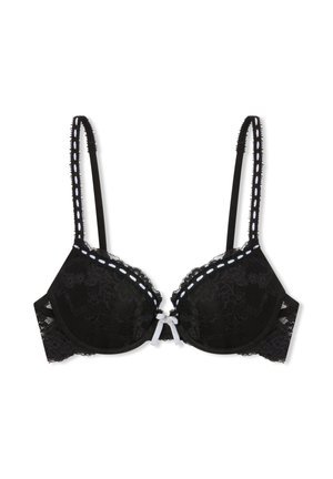 Reggiseno in pizzo nero con coppe imbottite, decorazione con cuciture bianche lungo i bordi, spalline regolabili e un piccolo fiocco bianco al centro davanti.