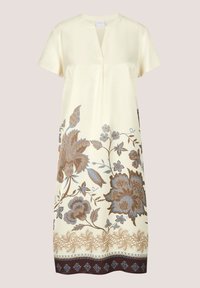 Robe crème mi-longue aux genoux, manches courtes, col en V, avec des motifs floraux bleus et marron le long du bas et de la bordure de l'ourlet.