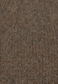 Tessuto di lana lavorato a maglia, con una texture grezza e spessa, in un ricco colore marrone con sottili variazioni. Punti equidistanti conferiscono un aspetto caldo.