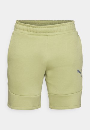 Világoszöld sportnadrág, rugalmas derékrésszel, sima textúrával és oldalsó varrásokkal. Az alsó bal részen egy szürke logo található.