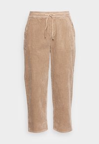 Beige corduroy broek met een relaxte pasvorm, elastische tailleband, trekkoord en zijzakken. Soepele textuur met verticale ribbels.