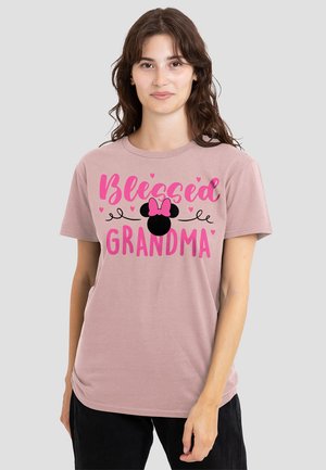 Light pink t-shirt featuring the text "Blessed Grandma" in bold pink letters, with a black Mickey Mouse silhouette and decorative hearts.