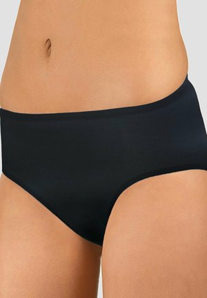 Woman's midsection wearing plain black seamless underwear against a light gray background.