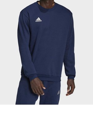 Sudadera azul marino hecha de una mezcla de algodón con cuello redondo, puños y dobladillo acanalados, que presenta un logo blanco de Adidas en el lado izquierdo del pecho.