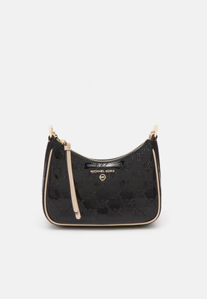 Sac à main en cuir verni noir Michael Kors avec motif logo MK embossé, bordure beige, fermeture éclair dorée et bandoulière beige réglable.