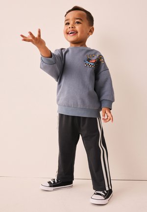 Next, REGULAR FIT - WIDE LEG SIDE STRIPE JOGGERS  . - Verryttelyhousut - charcoal grey