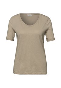 T-shirt beige à manches courtes avec encolure dégagée, en tissu léger à texture, portant l'étiquette "Street One" au col.