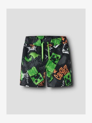 Black shorts with green pixelated Creeper characters and graffiti-style text in green, orange, and white, featuring a green drawstring waist.