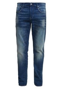 Džínové kalhoty v tmavě modré barvě se světlým omytem. Obsahují pět kapes, poutka na opasek a zapínání na knoflík. Rovný střih a střední hmotnost.