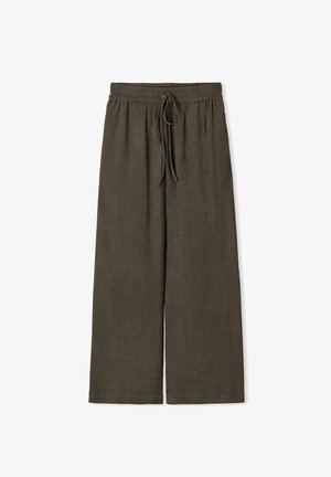 Pantalons à jambes larges en vert olive foncé, fabriqués en tissu texturé. Ils présentent une taille élastique avec un cordon de serrage pour un ajustement réglable.