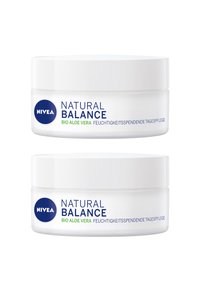 NIVEA Natural Balance cream jars, white plastic, round shape. Labels in blue and green text, featuring "Bio Aloe Vera," with a smooth finish.