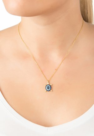 Gold chain necklace with a turtle-shaped pendant featuring a blue and light blue gemstone design and four small golden feet.