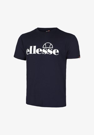 Camiseta de algodón azul marino con un logo blanco de "ellesse" en el pecho, diseño de cuello redondo y mangas cortas. Corte clásico, textura suave.