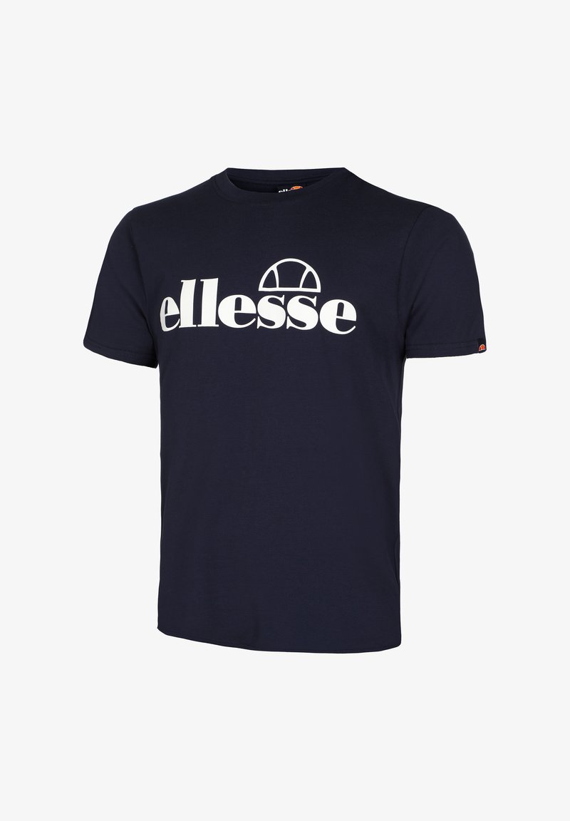 Tengerészkék pamut póló, fehér "ellesse" logóval az elején, kerek nyakú kialakítással és rövid ujjal. Klasszikus szabás, sima textúrával.