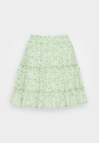 Vihreä, kerroksellinen hame, jossa on ryppypaita ja kukkakuosi, jossa valkoisia ja mustia päivänkakkaroita vaaleanvihreällä taustalla.