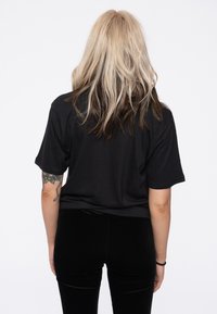 Paradiso Clothing DRAWN BAND LOGO - Print T-shirt - black