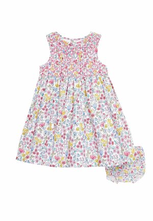 Robe bébé sans manches et bloomer assorti avec motif floral rose, jaune et bleu sur tissu blanc.