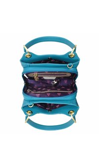 Turquoise leren handtas met een gestructureerde vorm, voorzien van een paarse bloemenpatroon interieur, ritszakken en accenten van goudkleurig metaal.