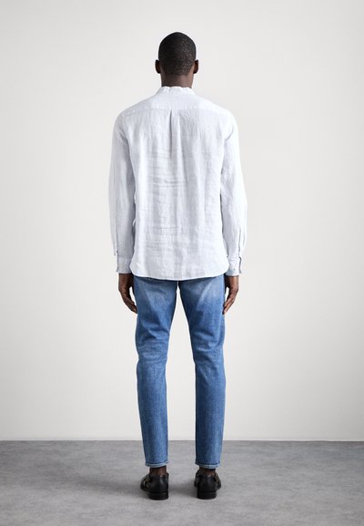 Tiger of Sweden PISTOLERO - Slim fit jeans - light blue