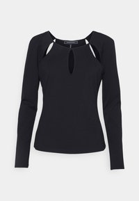 Svart långärmad topp med en nyckelhålsnack och utskärningar vid axlarna. Tillverkad av ett elastiskt material med en figurnära silhuett.