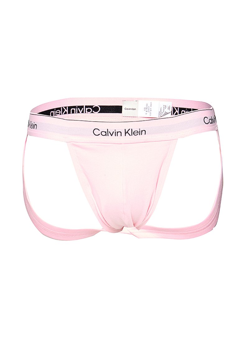 Helle rosa Calvin Klein Herren-Jockstrap mit schwarzem Logo am Bund und angehängtem Pflegeetikett.