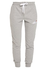 Grå sweatpants i en bomullsblandning, med vit dragsko och broderad logotyp. Avsmalnande ben med ribbade muddar och sidofickor.