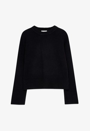 Pull noir court en matière tricotée, avec un col et des poignets côtelés, des manches longues et une coupe décontractée.