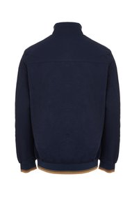 Giacca blu navy con colletto alto, polsini elasticizzati e una vita con una striscia dorata e blu navy. Materiale morbido, design minimalista.