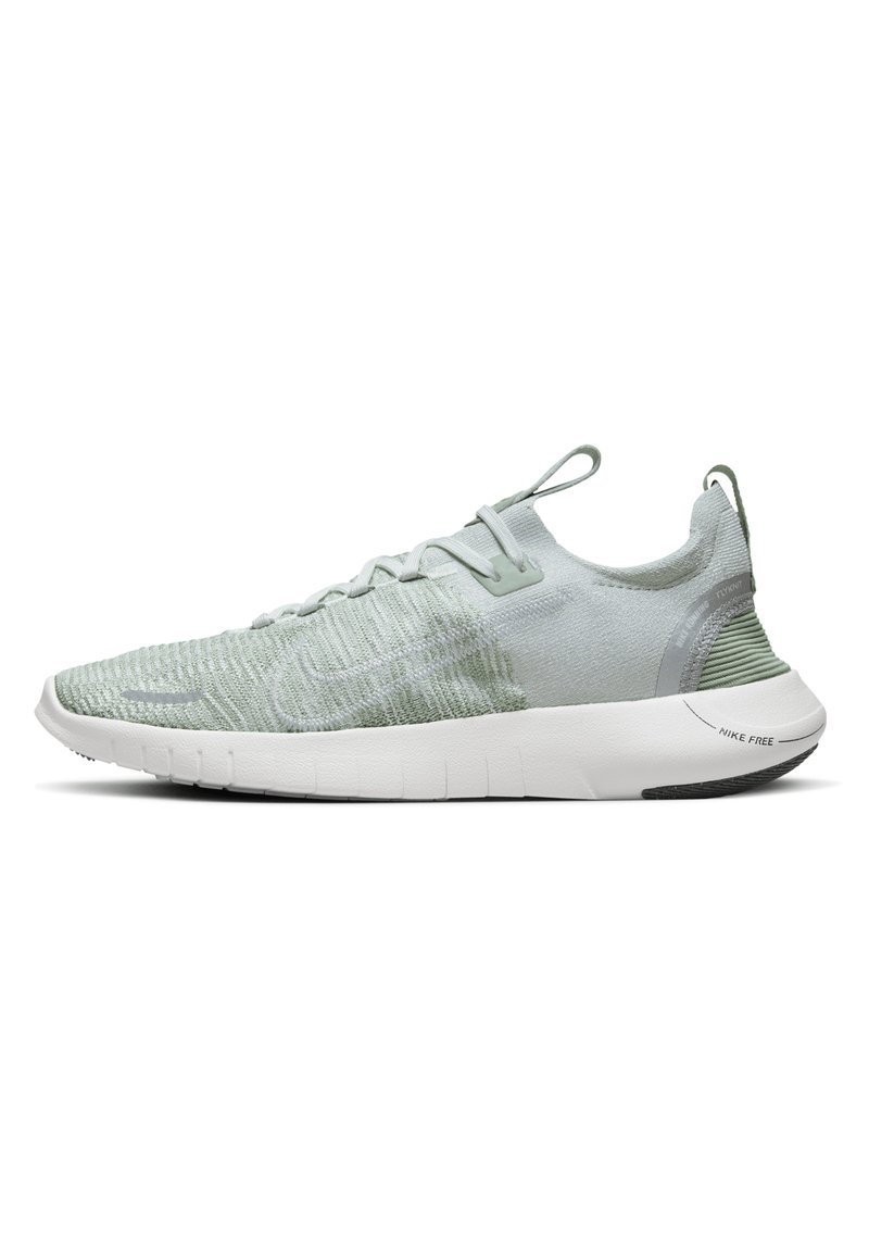 Light green athletic shoe with a textured knit upper, cushioned white sole, and distinct branding on the heel and side. Features lace-up design.